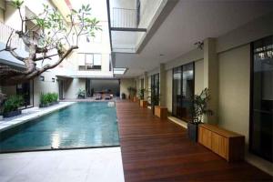 a large swimming pool in a large building at M Pavilion - Lippo Karawaci in Tangerang
