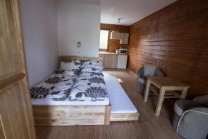 Postel nebo postele na pokoji v ubytování Domek Na Fali