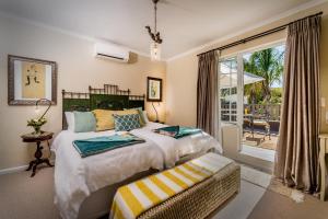 Ένα ή περισσότερα κρεβάτια σε δωμάτιο στο Baruch Guesthouse on Lovell +115 φωτογραφίες
