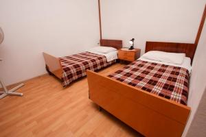 Postel nebo postele na pokoji v ubytování Apartments Stanko