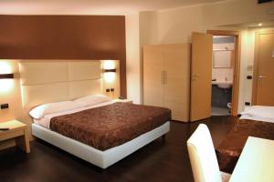 Postel nebo postele na pokoji v ubytování Hotel Sogni D'Oro Airport