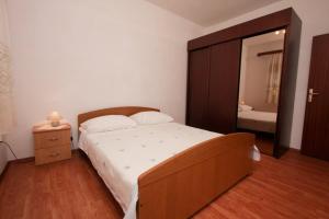 Postel nebo postele na pokoji v ubytování Apartments Stanko