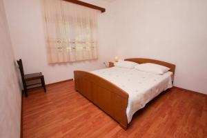 Postel nebo postele na pokoji v ubytování Apartments Stanko