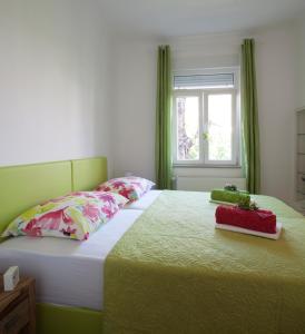 a bedroom with a large bed and a window at Azure in Zagreb
