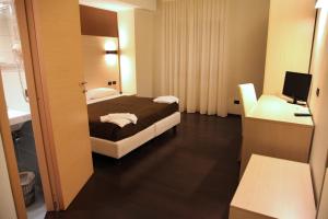Postel nebo postele na pokoji v ubytování Hotel Sogni D'Oro Airport