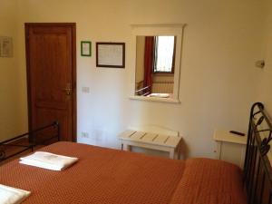 Postel nebo postele na pokoji v ubytování Albergo Sonia
