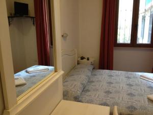 Postel nebo postele na pokoji v ubytování Albergo Sonia