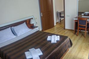 Postel nebo postele na pokoji v ubytování Golden Fleece Hotel