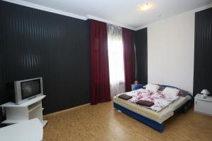 Posteľ alebo postele v izbe v ubytovaní Praktik Hotel & Restaurant