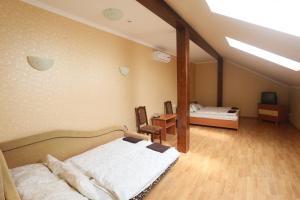 Posteľ alebo postele v izbe v ubytovaní Praktik Hotel & Restaurant