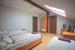 Posteľ alebo postele v izbe v ubytovaní Praktik Hotel & Restaurant