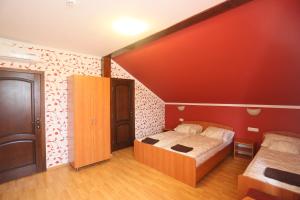 Posteľ alebo postele v izbe v ubytovaní Praktik Hotel & Restaurant