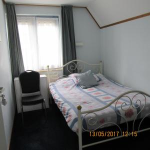 
A bed or beds in a room at Noemie's Pension House
