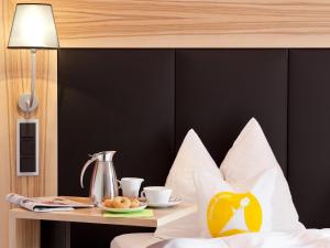 Postel nebo postele na pokoji v ubytování Avenon Privat-Hotel Am Steinberg
