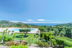 an aerial view of a resort with a swimming pool and trees at Residence Le Hameau Cap Esterel - maeva Home in Agay - Saint Raphael