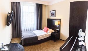 Posteľ alebo postele v izbe v ubytovaní Hotel Fado Spa & Restaurant
