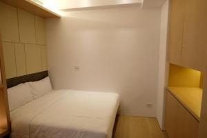 Postel nebo postele na pokoji v ubytování iLiving B&B