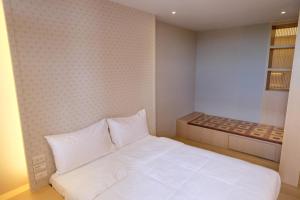 Postel nebo postele na pokoji v ubytování iLiving B&B