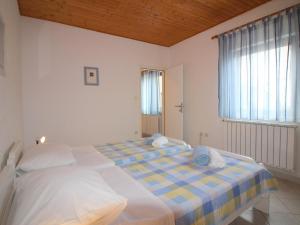 Łóżko lub łóżka w pokoju w obiekcie Apartment in Porec - Istrien 9922