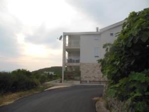 a building on the side of a road at Apartment Vila Mirela in Krimovice