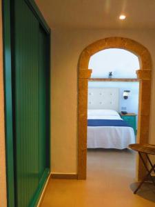 Postel nebo postele na pokoji v ubytování HOTEL MAÑET