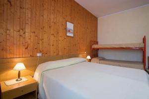 Ένα ή περισσότερα κρεβάτια σε δωμάτιο στο La Villa