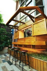 a group of stools in front of a building at Xie Tong Homestay in Ji'an