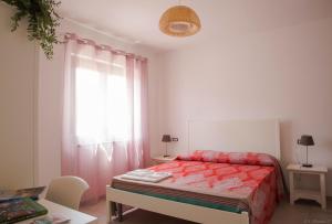 Łóżko lub łóżka w pokoju w obiekcie B&B Agata e gli altri