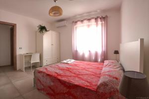Łóżko lub łóżka w pokoju w obiekcie B&B Agata e gli altri