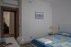 Łóżko lub łóżka w pokoju w obiekcie B&B Agata e gli altri