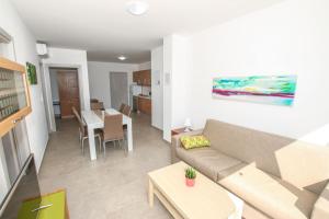 a living room with a couch and a table at Apartment in Funtana with Two-Bedrooms 1 in Funtana