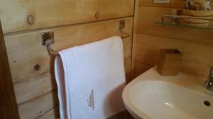 a towel hanging on a towel rack in a bathroom at Vodenica Vrelo Chalets in Vrelo Koreničko +38 photos