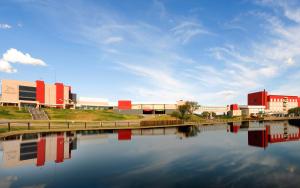 a building next to a body of water at Epic Hotel San Luis in La Punta