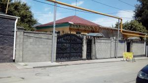 a gate in front of a building at Hostel Viator in Almaty