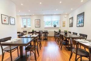 a large dining room with tables and chairs at Villa 7 in Flachau