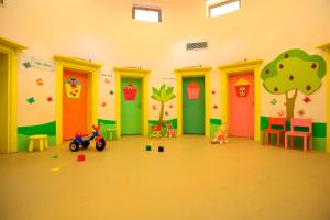 a room with colorful doors and toys in it at Martı Myra - Ultra All Inclusive in Tekirova