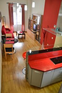 a living room with a red counter top at Alameda San Lorenzo Loft in Seville