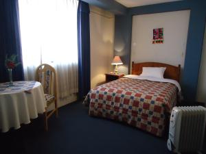 Postel nebo postele na pokoji v ubytování Hotel T'ika