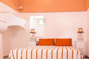 Un pat sau paturi într-o cameră la Villa Sorrentino Ostuni