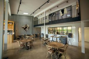 a restaurant with tables and chairs in a room at Blabjorg Resort in Borgarfjordur Eystri