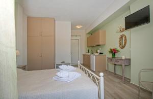 Posteľ alebo postele v izbe v ubytovaní Avlemonas Bay Sea Houses.