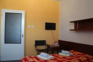 Postel nebo postele na pokoji v ubytování Hotel Rambousek