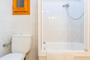 a bathroom with a toilet and a shower at Cal Ginés in Llimiana +24 photos