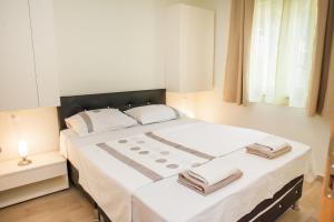 Postel nebo postele na pokoji v ubytování Apartments Villa Matea + 37 fotografií