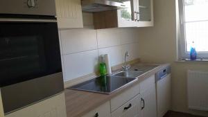 a kitchen with a sink and a counter top at B & B Beckord Erlengrund in Hodenhagen