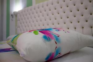 Postel nebo postele na pokoji v ubytování B&B L'Arcobaleno