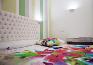 Postel nebo postele na pokoji v ubytování B&B L'Arcobaleno