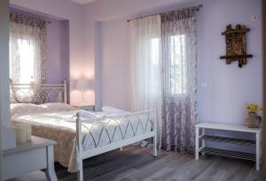 Posteľ alebo postele v izbe v ubytovaní Avlemonas Bay Sea Houses.