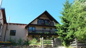 a large house with a gambrel roof at Cabana Ada 2 in Vartop +20 photos
