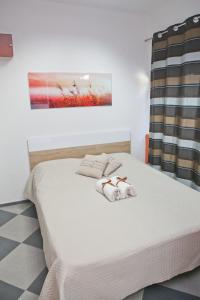 Una cama o camas en una habitación de Apartments Qualitas